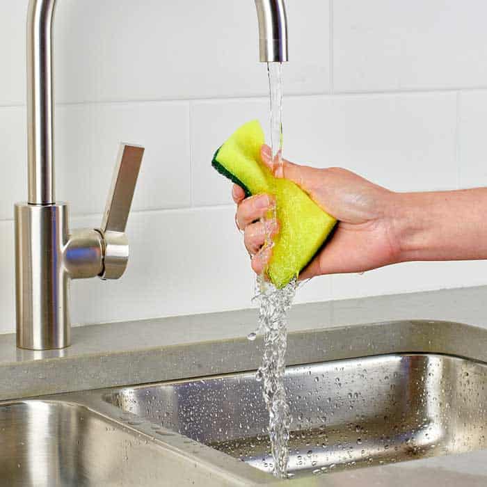 Scrub The Sink With A Scouring Sponge